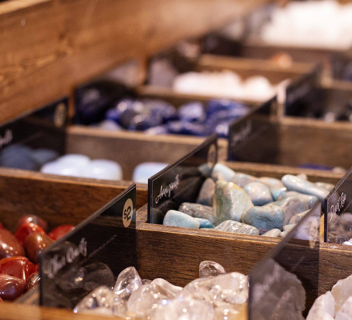 Crystals in wooden display trays at Virgo Room